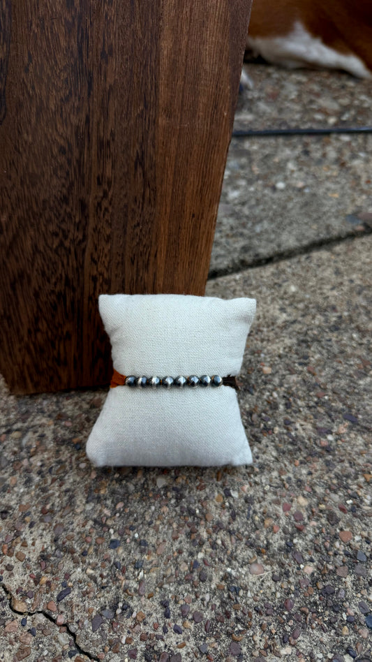 Orange and brown fabric bracelet