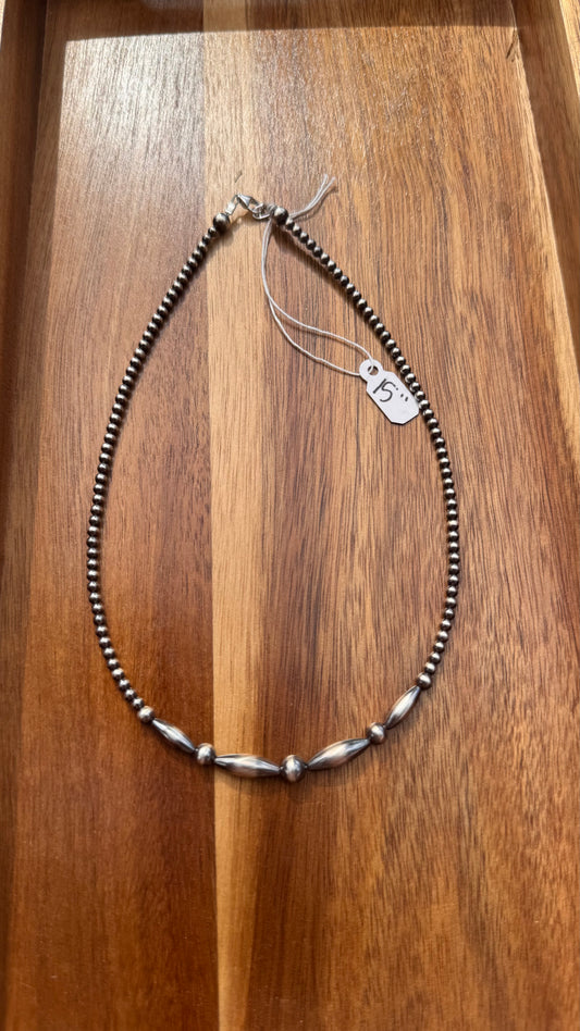 Graduated torpedo necklace